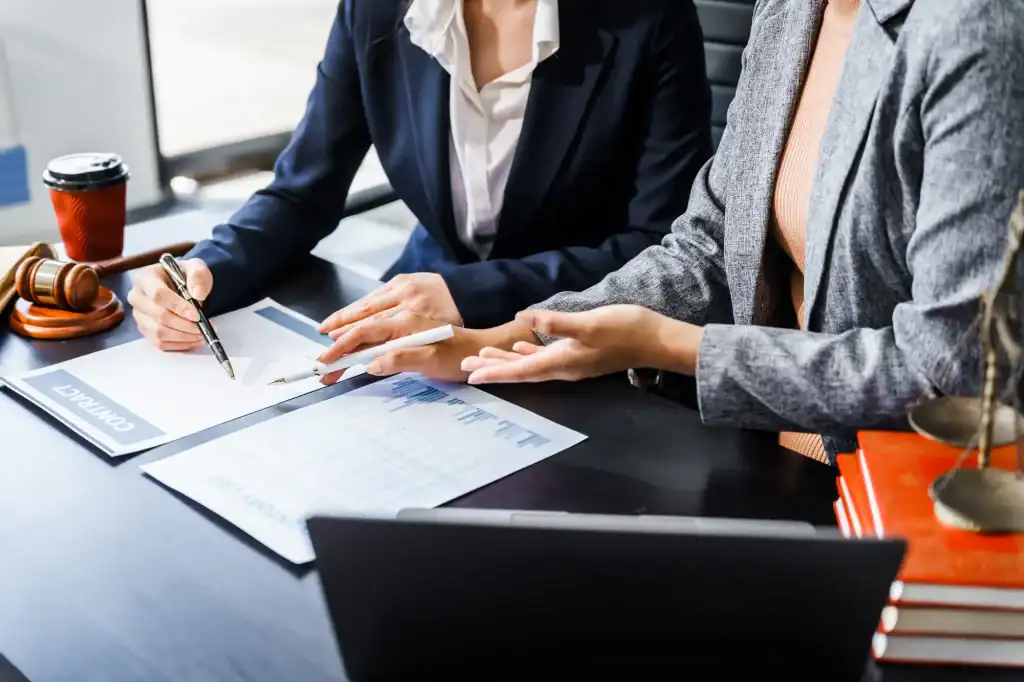 Business professionals reviewing tax documents during a meeting in Wayne County, Pennsylvania, representing All County Tax Resolution services