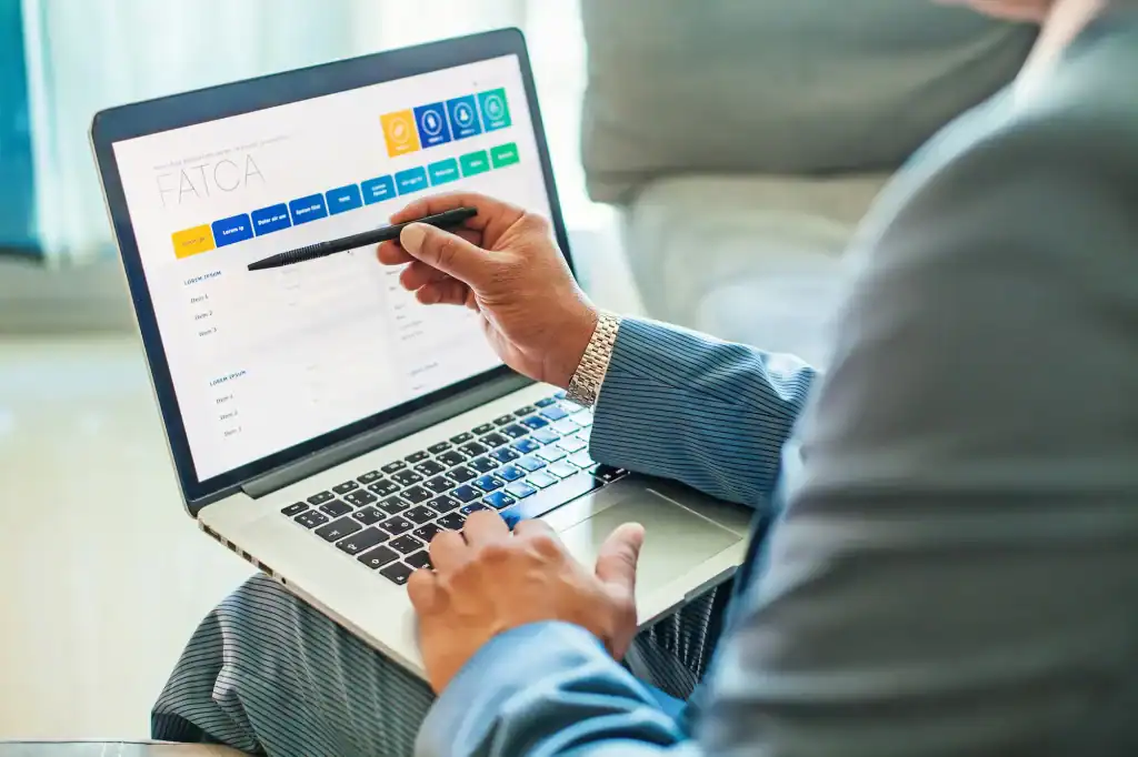 FATCA form on laptop screen, financial tax resolution, tax compliance documentation, tax regulations, all county tax resolution services.