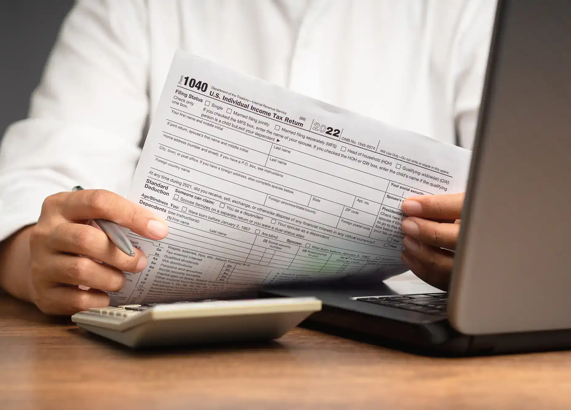 Professional reviewing tax filing documents for clients in Wayne County, Pennsylvania at All County Tax Resolution office